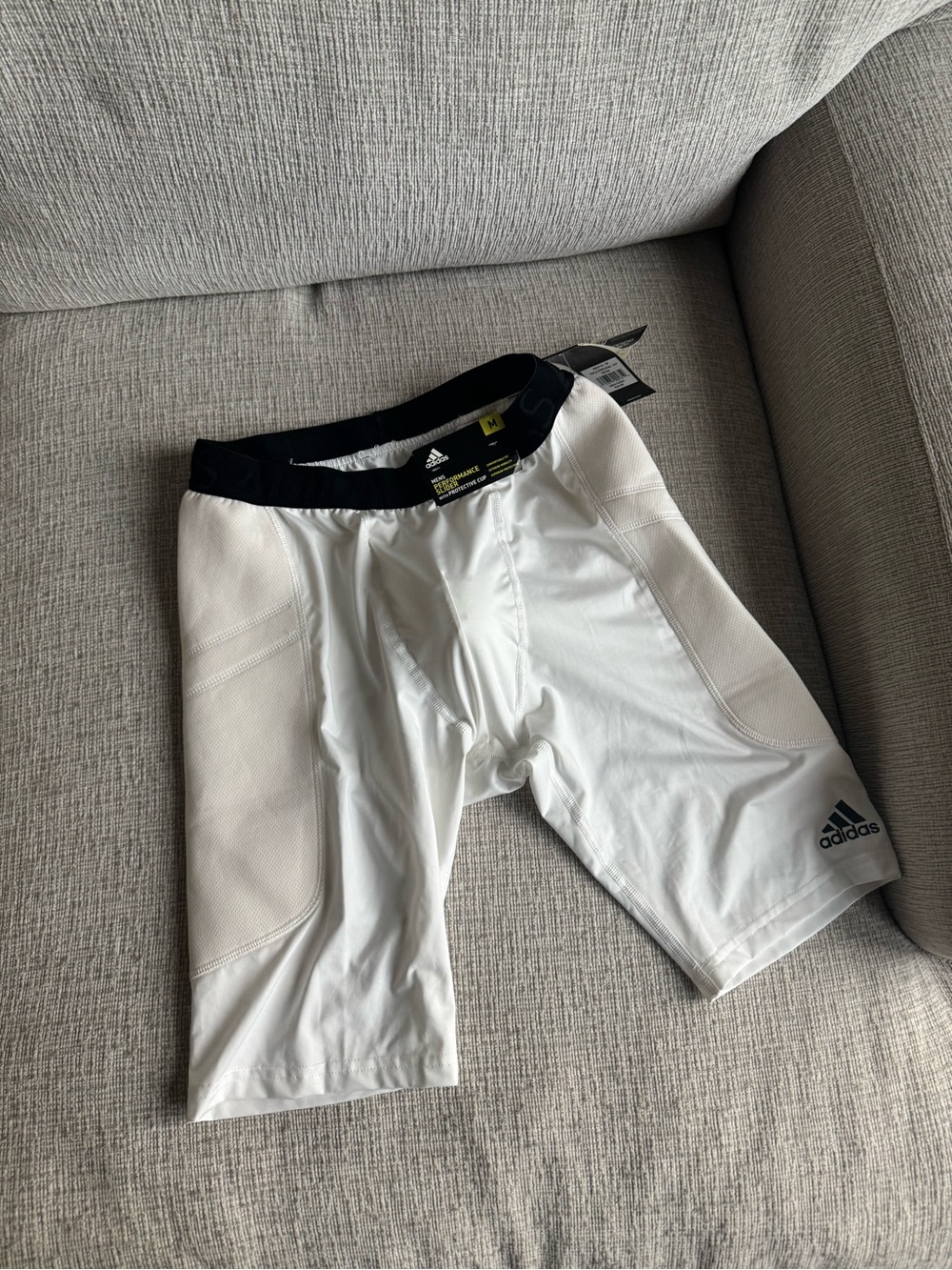 adidas Men's White performance slider with protective cup
